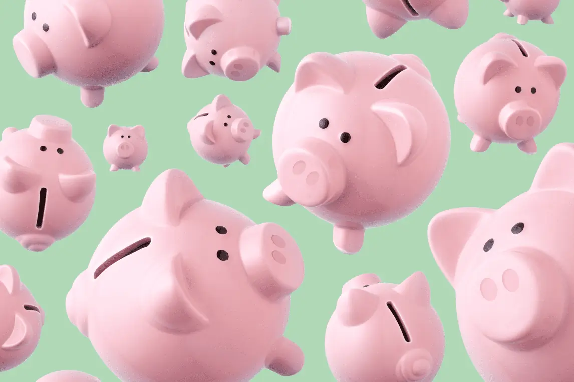 Blogpost-Bild-Ruecklagenbildung Viele rosa Sparschweine auf grünem Hintergrund